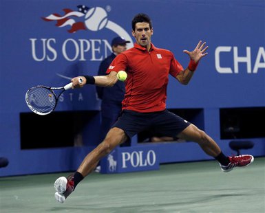 Novak Djokovic of Serbia hits a return to Rafael Nadal of Spain during their men's final match at the U.S. Open tennis championships in New Novak Djokovic of Serbia hits a return to Rafael Nadal of Spain during their men's final match at the U.S. Open tennis championships in New