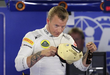 Lotus F1 Formula One driver Kimi Raikkonen of Finland wears his cap during the third practice session of the Italian F1 Grand Prix at the Mo Lotus F1 Formula One driver Kimi Raikkonen of Finland wears his cap during the third practice session of the Italian F1 Grand Prix at the Mo