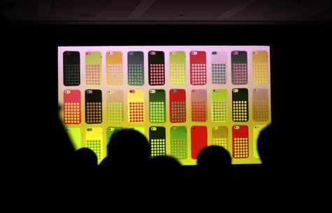 Journalists watch a screen showing the new iPhone 5C in different colours at Apple Inc's announcement event in Beijing, September 11, 2013. Journalists watch a screen showing the new iPhone 5C in different colours at Apple Inc's announcement event in Beijing, September 11, 2013.