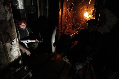 Free Syrian Army fighters smoke cigarettes as they rest in Aleppo's Qastal al-Harami neighbourhood September 11, 2013. REUTERS/Nour Kelze Free Syrian Army fighters smoke cigarettes as they rest in Aleppo's Qastal al-Harami neighbourhood September 11, 2013. REUTERS/Nour Kelze