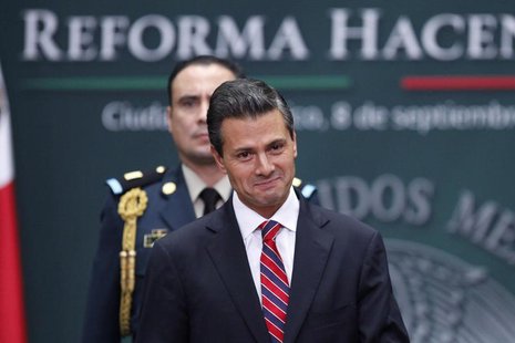 Mexico's President Enrique Pena Nieto smiles during the presentation of the fiscal reform at Los Pinos presidential residence in Mexico City Mexico's President Enrique Pena Nieto smiles during the presentation of the fiscal reform at Los Pinos presidential residence in Mexico City