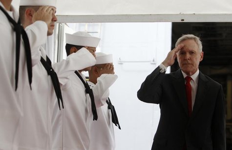 U.S. Secretary of the Navy Ray Mabus salutes servicemen onboard the USS Freedom littoral combat ship during a visit at Changi Naval Base in U.S. Secretary of the Navy Ray Mabus salutes servicemen onboard the USS Freedom littoral combat ship during a visit at Changi Naval Base in