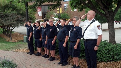 Green Bay Metro firefighters salute commemorating the 12th anniversary of the 9-11 terrorist attacks. (Photo by: WTAQ Reporter Jeff Flynt). Green Bay Metro firefighters salute commemorating the 12th anniversary of the 9-11 terrorist attacks. (Photo by: WTAQ Reporter Jeff Flynt).