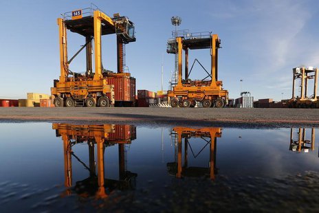Container cranes are seen reflected in water at Italy's biggest port Gioia Tauro in the southern Italian region of Calabria, November 8, 201 Container cranes are seen reflected in water at Italy's biggest port Gioia Tauro in the southern Italian region of Calabria, November 8, 201