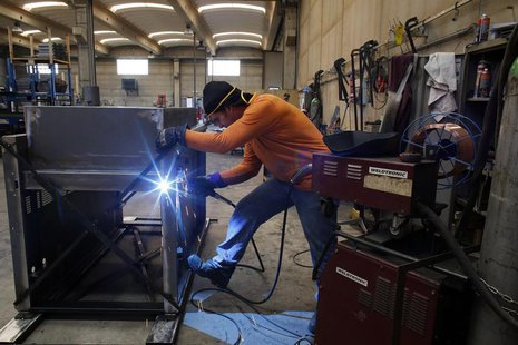 A worker welds a metal furnace in a factory in Gravellona Lomellina, 45km (27 miles) southwest of Milan, June 11, 2013. REUTERS/Stefano Rell A worker welds a metal furnace in a factory in Gravellona Lomellina, 45km (27 miles) southwest of Milan, June 11, 2013. REUTERS/Stefano Rell