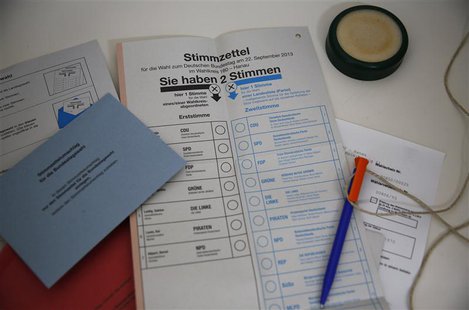 Voting papers for the upcoming German general elections are seen inside a "mail-voting" booth at the town hall of Hanau, 30km south of Frank Voting papers for the upcoming German general elections are seen inside a "mail-voting" booth at the town hall of Hanau, 30km south of Frank