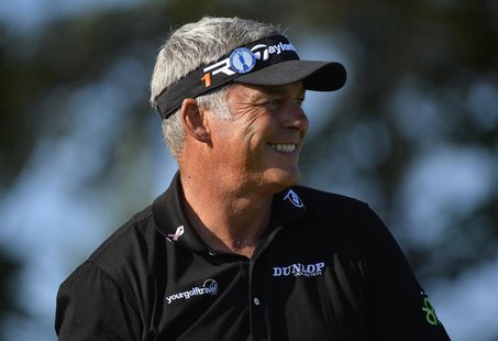 Darren Clarke of Northern Ireland smiles as he stands on the second tee during the second round of the British Open golf Championship at Mui Darren Clarke of Northern Ireland smiles as he stands on the second tee during the second round of the British Open golf Championship at Mui