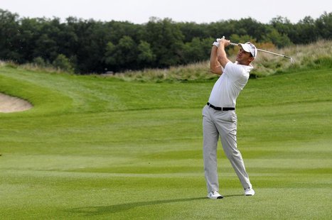 Former European Footballer of the Year Andriy Shevchenko takes a shot at the first hole during the Kharkov Superior Cup golf tournament in K Former European Footballer of the Year Andriy Shevchenko takes a shot at the first hole during the Kharkov Superior Cup golf tournament in K