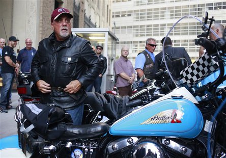 Singer Billy Joel gets off a motorcycle after riding from the Rescue 1 firehouse on West 43rd Street downtown to Ground Zero to honor the vi Singer Billy Joel gets off a motorcycle after riding from the Rescue 1 firehouse on West 43rd Street downtown to Ground Zero to honor the vi