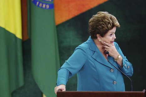 Brazil's President Dilma Rousseff speaks during a ceremony where she signs into law, the bill that allocates the country's oil royalties to Brazil's President Dilma Rousseff speaks during a ceremony where she signs into law, the bill that allocates the country's oil royalties to