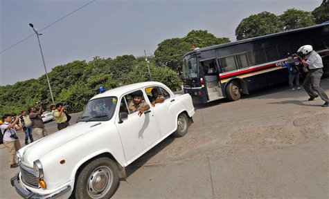 A police bus (R) carrying four men who were found guilty of the fatal gang-rape of a young woman on a bus in New Delhi, arrives at a court i A police bus (R) carrying four men who were found guilty of the fatal gang-rape of a young woman on a bus in New Delhi, arrives at a court i