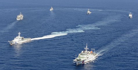 Vessels from the China Maritime Surveillance and the Japan Coast Guard are seen near disputed islands, called Senkaku in Japan and Diaoyu in Vessels from the China Maritime Surveillance and the Japan Coast Guard are seen near disputed islands, called Senkaku in Japan and Diaoyu in
