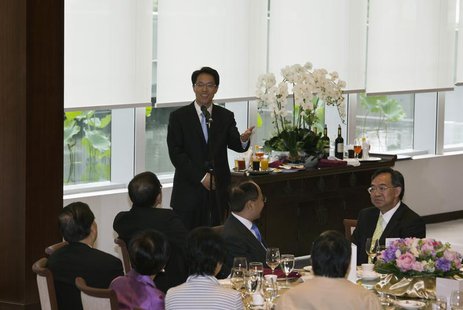 Zhang Xiaoming (C), director of China's Liaison Office, speaks during a lunch meeting at the Legislative Council in Hong Kong July 16, 2013. Zhang Xiaoming (C), director of China's Liaison Office, speaks during a lunch meeting at the Legislative Council in Hong Kong July 16, 2013.
