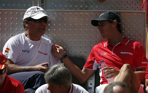 Spain's Rafael Nadal (R) chats with his uncle and coach Toni Nadal at the start of Davis Cup World Group playoff tennis tie between Spain's Spain's Rafael Nadal (R) chats with his uncle and coach Toni Nadal at the start of Davis Cup World Group playoff tennis tie between Spain's