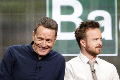Cast member Bryan Cranston (L) smiles next to co-star Aaron Paul at a panel for the television series "Breaking Bad" during the AMC portion Cast member Bryan Cranston (L) smiles next to co-star Aaron Paul at a panel for the television series "Breaking Bad" during the AMC portion