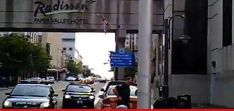 Image captured from video shot by two men detained by Appleton police for carrying AR-15 rifles to farmers market. (Photo from: YouTube). Image captured from video shot by two men detained by Appleton police for carrying AR-15 rifles to farmers market. (Photo from: YouTube).