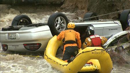 Emergency personnel work to rescue a man trapped in his vehicle during a flooding of Rock Creek in Lafayette, Colorado September 12, 2013, in this photo courtesy of CBS4 Denver.
REUTERS/CBS4 Denver/Handout via Reuters Emergency personnel work to rescue a man trapped in his vehicle during a flooding of Rock Creek in Lafayette, Colorado September 12, 2013, in this photo courtesy of CBS4 Denver.
REUTERS/CBS4 Denver/Handout via Reuters