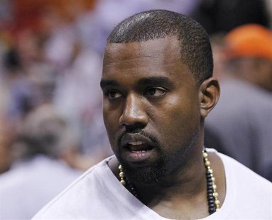 Rap musician Kanye West is seen court side as the Miami Heat play the New York Knicks in their NBA basketball game in Miami, Florida in this Rap musician Kanye West is seen court side as the Miami Heat play the New York Knicks in their NBA basketball game in Miami, Florida in this