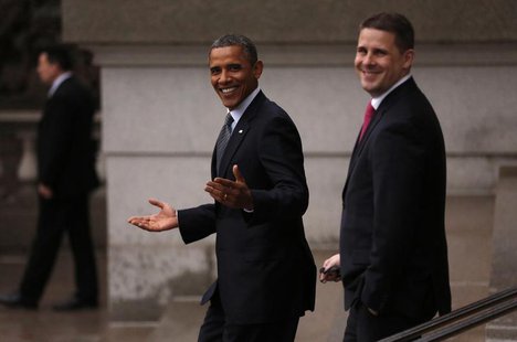 U.S. President Barack Obama gestures as he walks back to the White House from the Treasury after attending an event honoring outgoing Treasu U.S. President Barack Obama gestures as he walks back to the White House from the Treasury after attending an event honoring outgoing Treasu