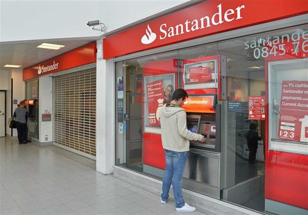 Customers use ATM machines at the Surrey Quays branch of Santander Bank, whilst the premises remain closed , in Surrey Quays, south London, Customers use ATM machines at the Surrey Quays branch of Santander Bank, whilst the premises remain closed , in Surrey Quays, south London,