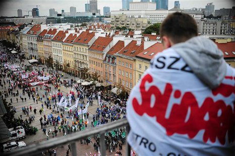 A protester from the Solidarity trade union looks down as people gather for an anti-government protest in central Warsaw September 14, 2013. A protester from the Solidarity trade union looks down as people gather for an anti-government protest in central Warsaw September 14, 2013.