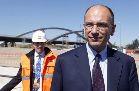 Italian Prime Minister Enrico Letta arrives at the construction site of Expo 2015, on the outskirts of Milan, September 13, 2013. REUTERS/ S Italian Prime Minister Enrico Letta arrives at the construction site of Expo 2015, on the outskirts of Milan, September 13, 2013. REUTERS/ S