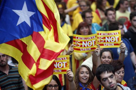 Separatist protesters hold up placards as they demonstrate during "Diada de Catalunya" (Catalunya's National Day) in central Barcelona, Sept Separatist protesters hold up placards as they demonstrate during "Diada de Catalunya" (Catalunya's National Day) in central Barcelona, Sept