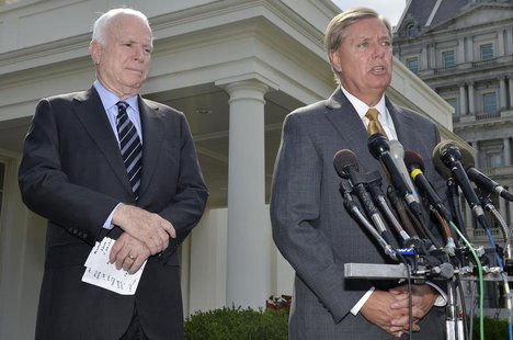 U.S. Senator Lindsey Graham (R-SC), (R), makes remarks to the media as U.S. Senator John McCain (R-AZ), (L), listens, after meeting with U.S U.S. Senator Lindsey Graham (R-SC), (R), makes remarks to the media as U.S. Senator John McCain (R-AZ), (L), listens, after meeting with U.S