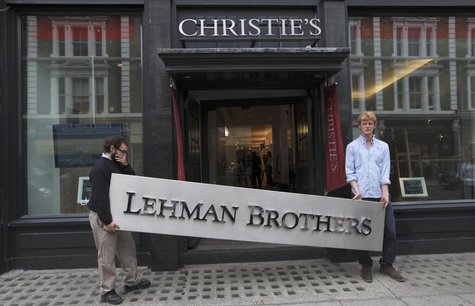 Christie's employees pose for a photograph with a Lehman Brothers sign at Christie's in central London September 24, 2010. REUTERS/Andrew Wi Christie's employees pose for a photograph with a Lehman Brothers sign at Christie's in central London September 24, 2010. REUTERS/Andrew Wi