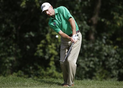 Jim Furyk of U.S. chips on the sixth hole during the third round of the BMW Championship golf tournament at the Conway Farms Golf Club in La Jim Furyk of U.S. chips on the sixth hole during the third round of the BMW Championship golf tournament at the Conway Farms Golf Club in La