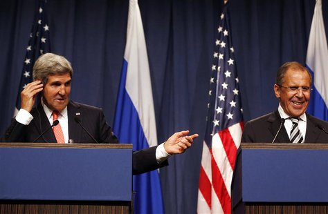 U.S. Secretary of State John Kerry (L) gestures next to Russian Foreign Minister Sergei Lavrov as they make statements following meetings re U.S. Secretary of State John Kerry (L) gestures next to Russian Foreign Minister Sergei Lavrov as they make statements following meetings re