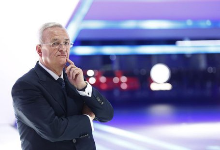 Volkswagen CEO Martin Winterkorn waits for German Chancellor Angela Merkel during the official opening of the Frankfurt Motor Show (IAA) in Volkswagen CEO Martin Winterkorn waits for German Chancellor Angela Merkel during the official opening of the Frankfurt Motor Show (IAA) in