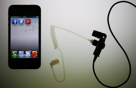 The application icons of Facebook, Twitter and Google are displayed on an iPhone next to an earphone set in this illustration photo taken in The application icons of Facebook, Twitter and Google are displayed on an iPhone next to an earphone set in this illustration photo taken in