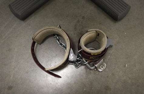 An ankle shackle used by prisoners during meetings with their lawyers is seen on the floor of the conference room at Camp VI, a prison used An ankle shackle used by prisoners during meetings with their lawyers is seen on the floor of the conference room at Camp VI, a prison used