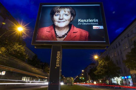 A long exposure photograph shows an election campaign poster of German Chancellor and conservative Christian Democratic Union (CDU) leader A A long exposure photograph shows an election campaign poster of German Chancellor and conservative Christian Democratic Union (CDU) leader A