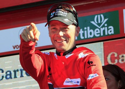 Chris Horner of the U.S. celebrates on the podium after retaking the overall race lead in the 181-km 19th stage of the Vuelta, Tour of Spain Chris Horner of the U.S. celebrates on the podium after retaking the overall race lead in the 181-km 19th stage of the Vuelta, Tour of Spain