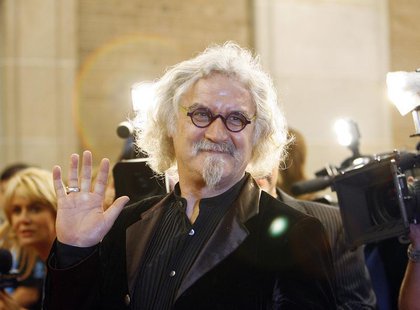 Cast member Billy Connolly waves at the premiere of "Fido" at the Ryerson theatre during the 31st Toronto International Film Festival in Tor Cast member Billy Connolly waves at the premiere of "Fido" at the Ryerson theatre during the 31st Toronto International Film Festival in Tor