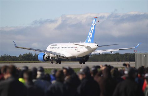 Bombardier employees and guests watch the CSeries aircraft taxi on the runway for its first test flight in Mirabel, Quebec, September 16, 20 Bombardier employees and guests watch the CSeries aircraft taxi on the runway for its first test flight in Mirabel, Quebec, September 16, 20