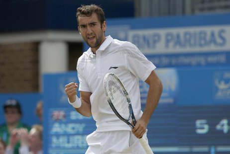 Croatia's Marin Cilic reacts after winning the first set during his men's singles final tennis match against Britain's Andy Murray at the Qu Croatia's Marin Cilic reacts after winning the first set during his men's singles final tennis match against Britain's Andy Murray at the Qu