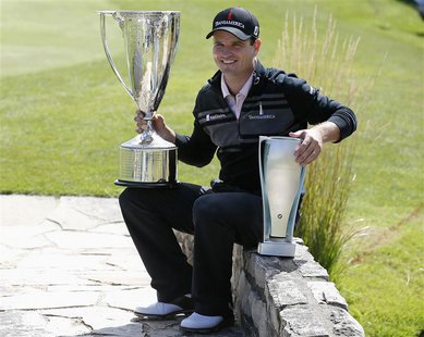 Zach Johnson of U.S.poses after winning the BMW Championship golf tournament at the Conway Farms Golf Club in Lake Forest, Illinois, Septemb Zach Johnson of U.S.poses after winning the BMW Championship golf tournament at the Conway Farms Golf Club in Lake Forest, Illinois, Septemb