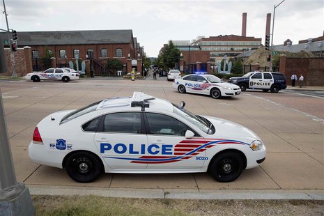 Police cars are parked outside the U.S. Navy Yard after a shooting in Washington September 16, 2013. REUTERS/Joshua Roberts Police cars are parked outside the U.S. Navy Yard after a shooting in Washington September 16, 2013. REUTERS/Joshua Roberts