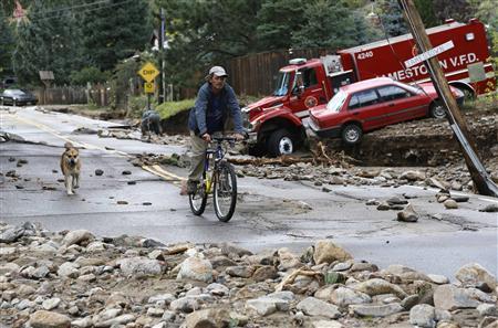 A resident rides down Main Street with his dog in Jamestown, Colorado, after a flash flood destroyed much of the town, September 14, 2013.
REUTERS/Rick Wilking A resident rides down Main Street with his dog in Jamestown, Colorado, after a flash flood destroyed much of the town, September 14, 2013.
REUTERS/Rick Wilking