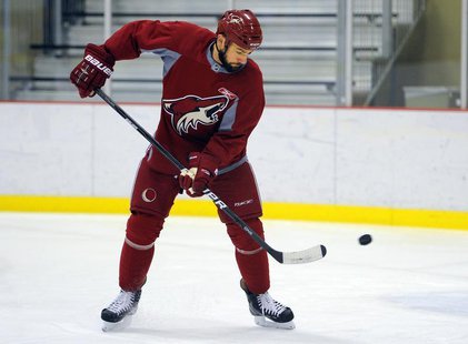 Phoenix Coyotes' Paul Bissonnette deflects a puck during their team practice in Scottsdale, Arizona May 16, 2012. REUTERS/Todd Korol Phoenix Coyotes' Paul Bissonnette deflects a puck during their team practice in Scottsdale, Arizona May 16, 2012. REUTERS/Todd Korol