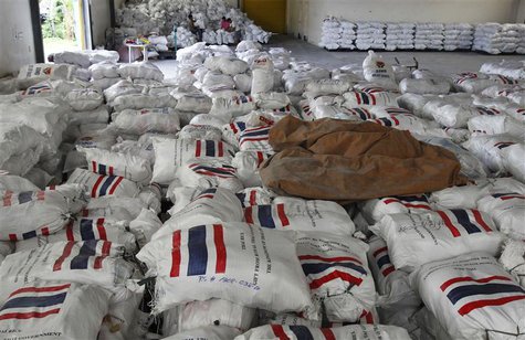 Volunteers (background) load relief goods and food rations (foreground) on a cart in a warehouse in Pasay city, metro Manila September 17, 2 Volunteers (background) load relief goods and food rations (foreground) on a cart in a warehouse in Pasay city, metro Manila September 17, 2
