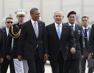 U.S. President Barack Obama (front L) participates in a farewell ceremony with Israeli Prime Minister Benjamin Netanyahu (front R) at Tel Av U.S. President Barack Obama (front L) participates in a farewell ceremony with Israeli Prime Minister Benjamin Netanyahu (front R) at Tel Av
