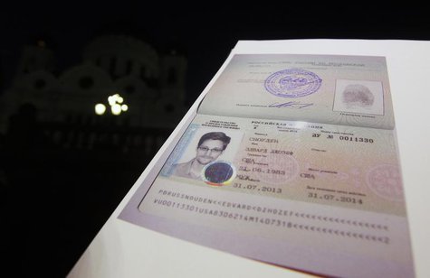 Fugitive former U.S. spy agency contractor Edward Snowden's new refugee documents granted by Russia is seen during a news conference in Mosc Fugitive former U.S. spy agency contractor Edward Snowden's new refugee documents granted by Russia is seen during a news conference in Mosc
