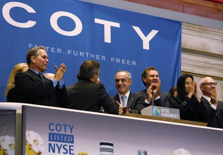 Michele Scannavini, (C) CEO of Coty Inc., and company representatives ring the opening bell at the New York Stock Exchange to celebrate the Michele Scannavini, (C) CEO of Coty Inc., and company representatives ring the opening bell at the New York Stock Exchange to celebrate the