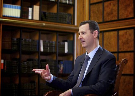 Syria's President Bashar al-Assad speaks during an interview with Russian state television RU24 in Damascus in this September 12, 2013 hando Syria's President Bashar al-Assad speaks during an interview with Russian state television RU24 in Damascus in this September 12, 2013 hando
