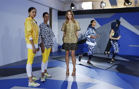 Designer Stella McCartney (C) poses with models wearing creations from the Adidas by Stella McCartney Spring/Summer 2014 collection during L Designer Stella McCartney (C) poses with models wearing creations from the Adidas by Stella McCartney Spring/Summer 2014 collection during L
