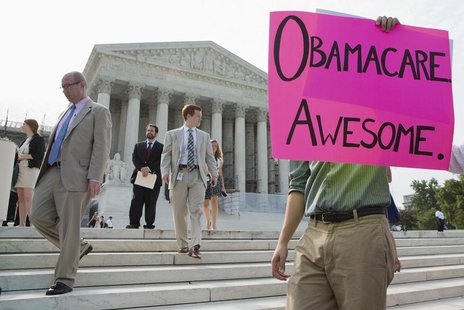 Supporters of the Affordable Healthcare Act gather in front of the Supreme Court before the court's announcement of the legality of the law Supporters of the Affordable Healthcare Act gather in front of the Supreme Court before the court's announcement of the legality of the law
